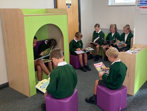 pupils reading in the new library area